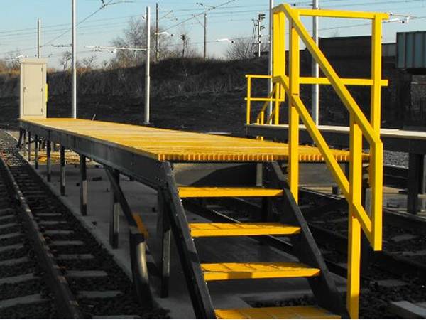 FRP/GRP yellow stair treads and yellow handrails of building and construction.