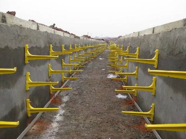 Yellow screw type cable brackets apply for cable trenches.