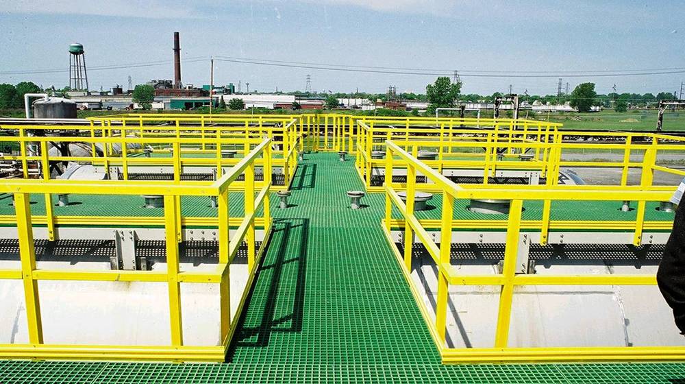 Yellow FRP/GRP handrails and green FRP/GRP grating walkways are installed in the waste water treatment plant. 