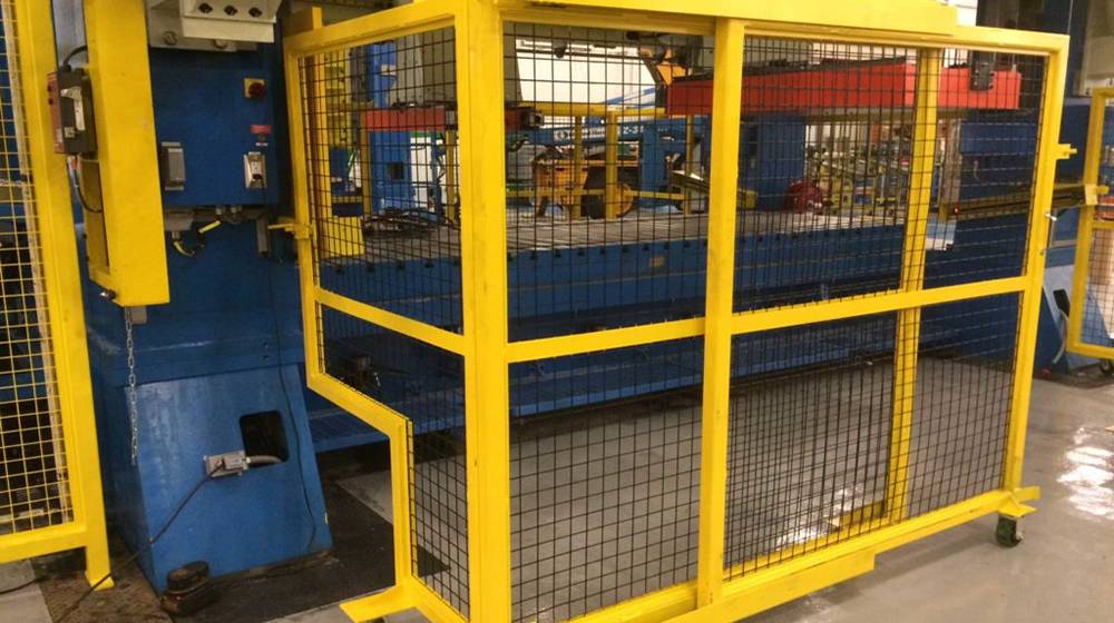 Yellow FRP/GRP profile frames is made into a machine guard for safe working.
