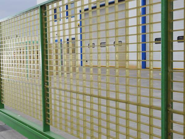 The FRP/GRP molded grating fencing is installed around the warehouse.