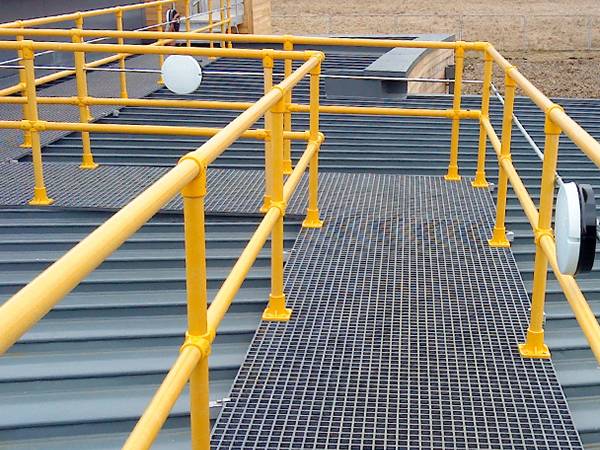 There are two yellow guardrails which are connected by three kinds of FRP/GRP handrail fittings.