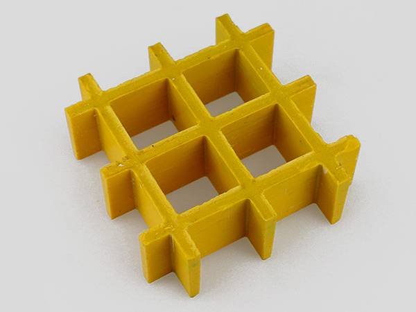 A piece of yellow color molded FRP/GRP grating with meniscus surface.