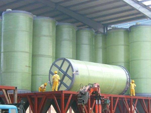 A truck is used for vertical FRP tanks transportation